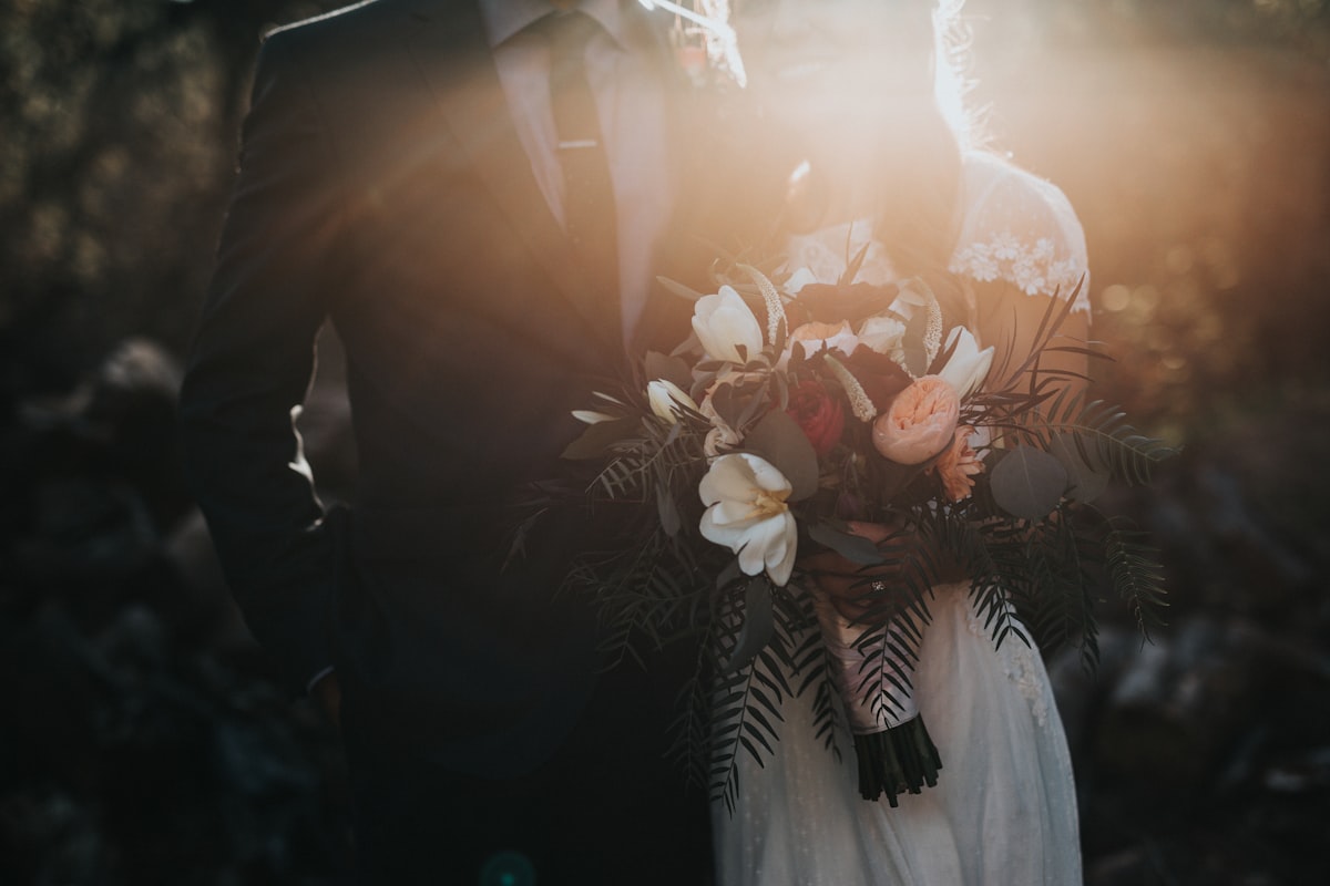 Couple at wedding mandap, candid moment
